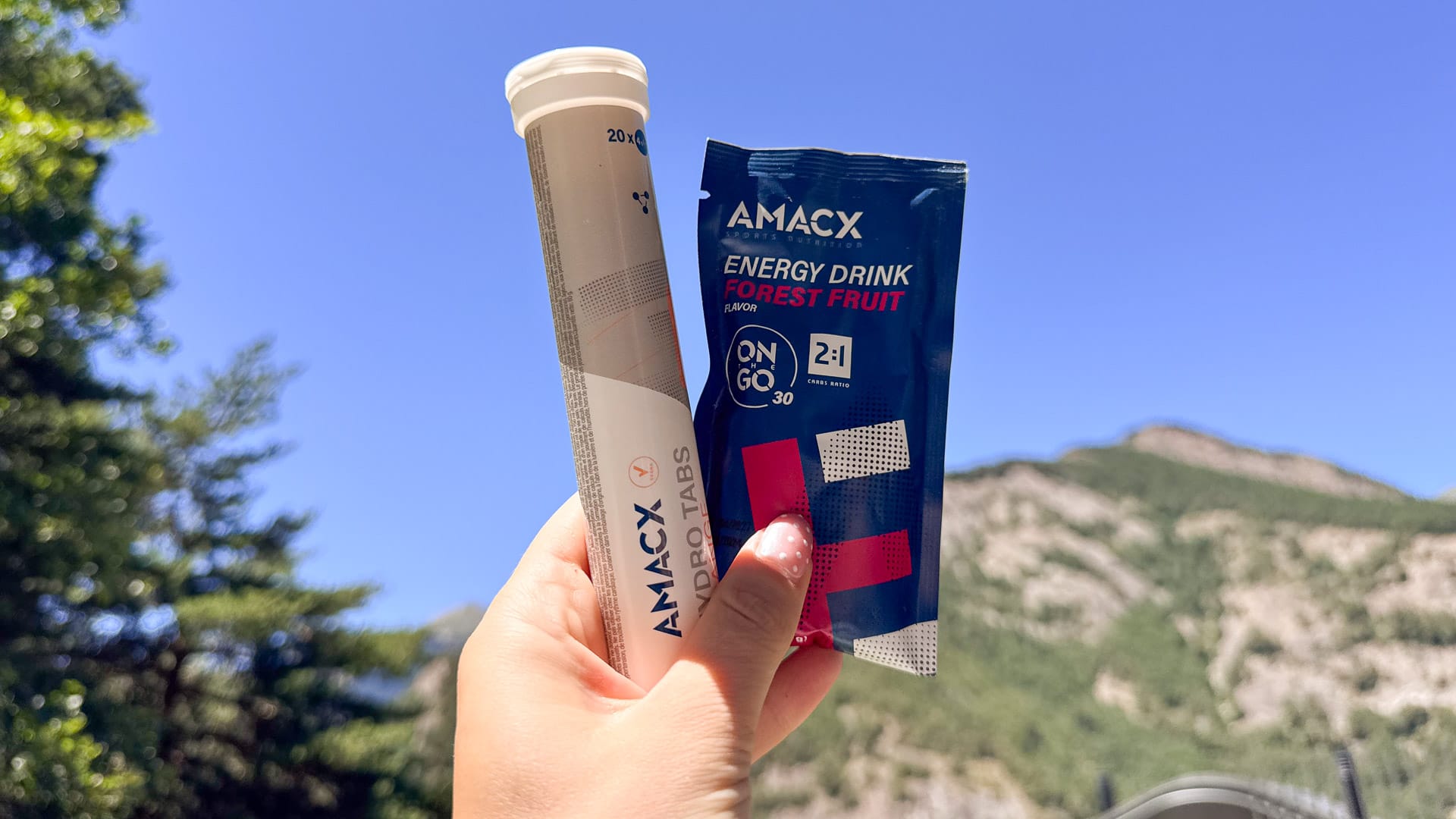 Tubes of hydration tablets and a cycling water bottle filled with an energy drink electrolyte mix.