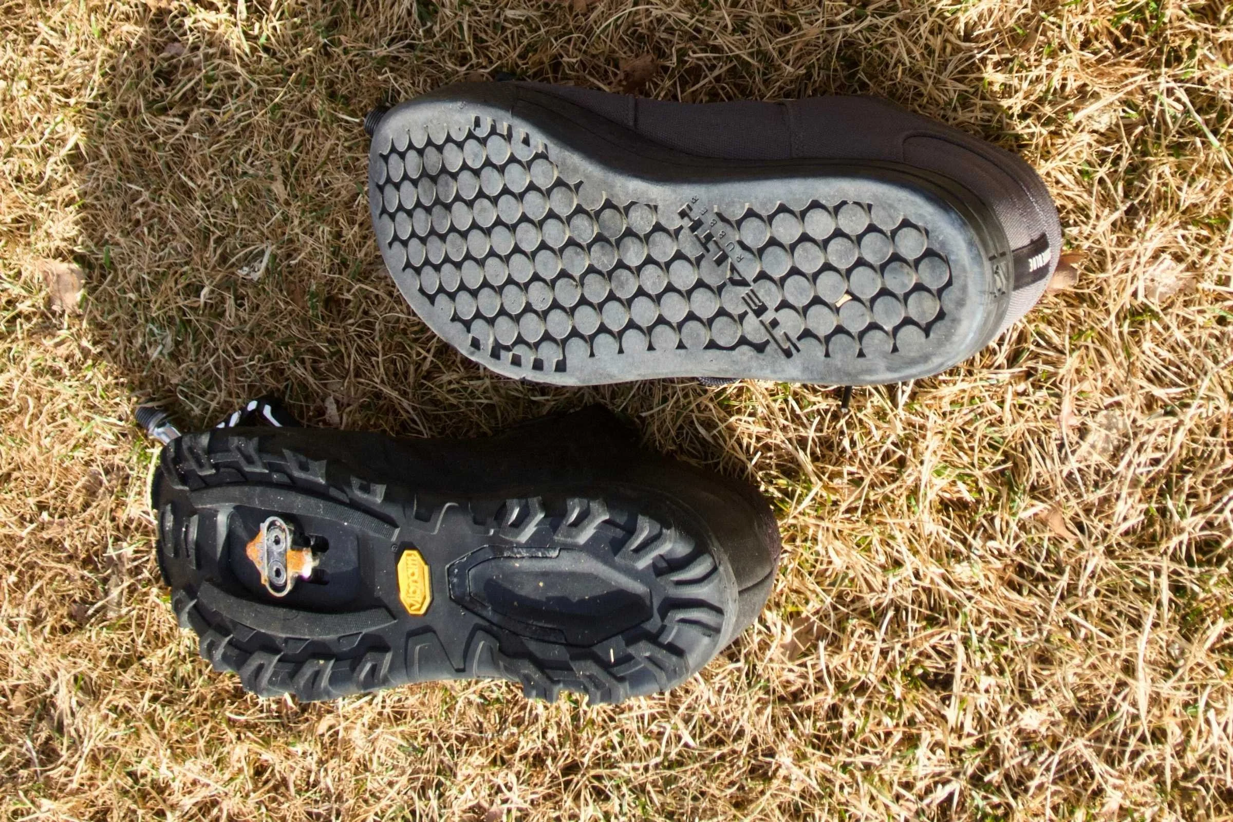 Comparison showing the difference between a flat pedal shoe sole and a clipless shoe sole with a recessed cleat mount.
