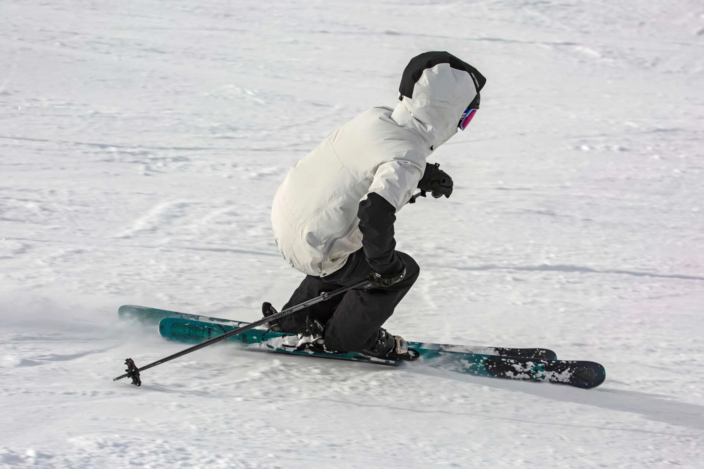 Close-up of the Arc'teryx Sentinel StormHood adjusted over a ski helmet.