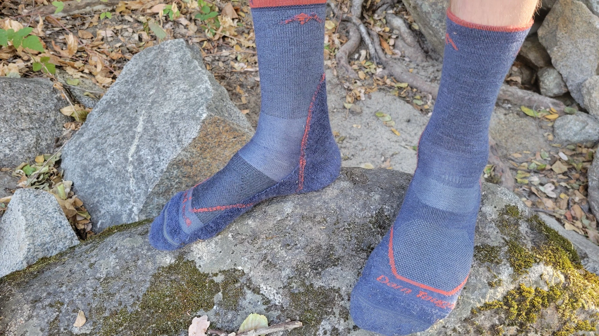 A hiking sock turned inside out to reveal the terry loop cushioning and compression stitching.