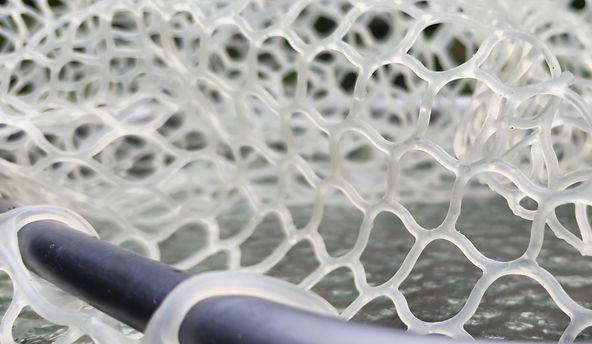 Close-up of a wooden landing net with fish-friendly clear rubber mesh.