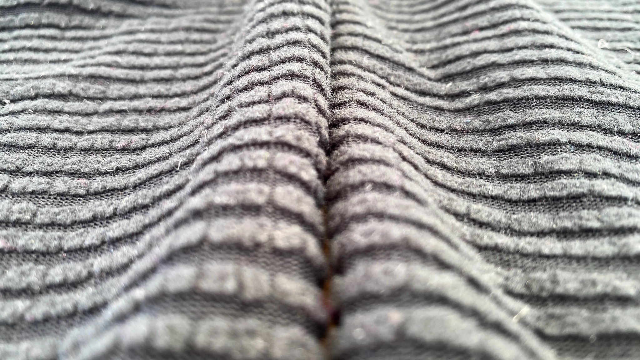 Detailed close-up of the Polartec fleece interior of a pair of thermal leggings.