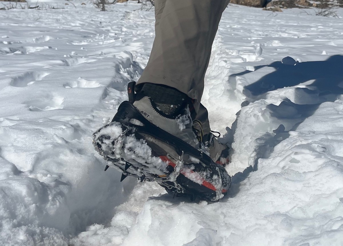 Assorted ice traction devices laid out to show differences in spike length and design.