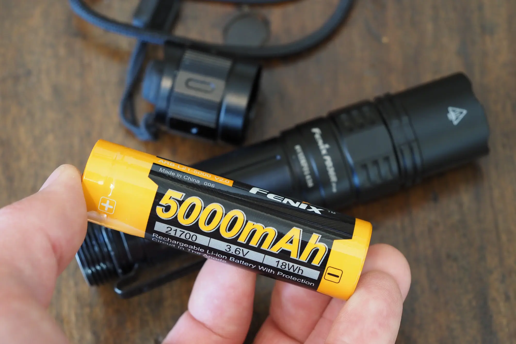 The 5000mAh 21700 rechargeable battery removed from a Fenix flashlight.