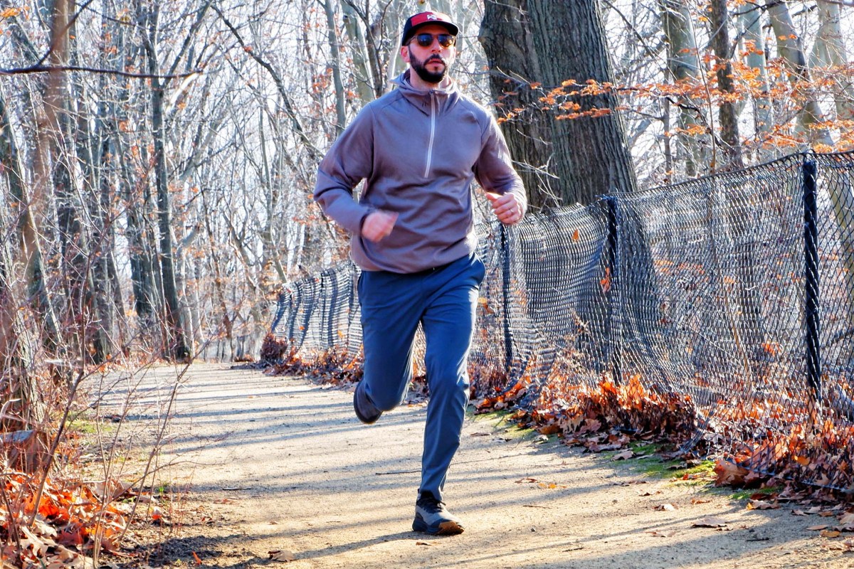 A studio-style shot of a dark-colored KEEN Roam hybrid running shoe.