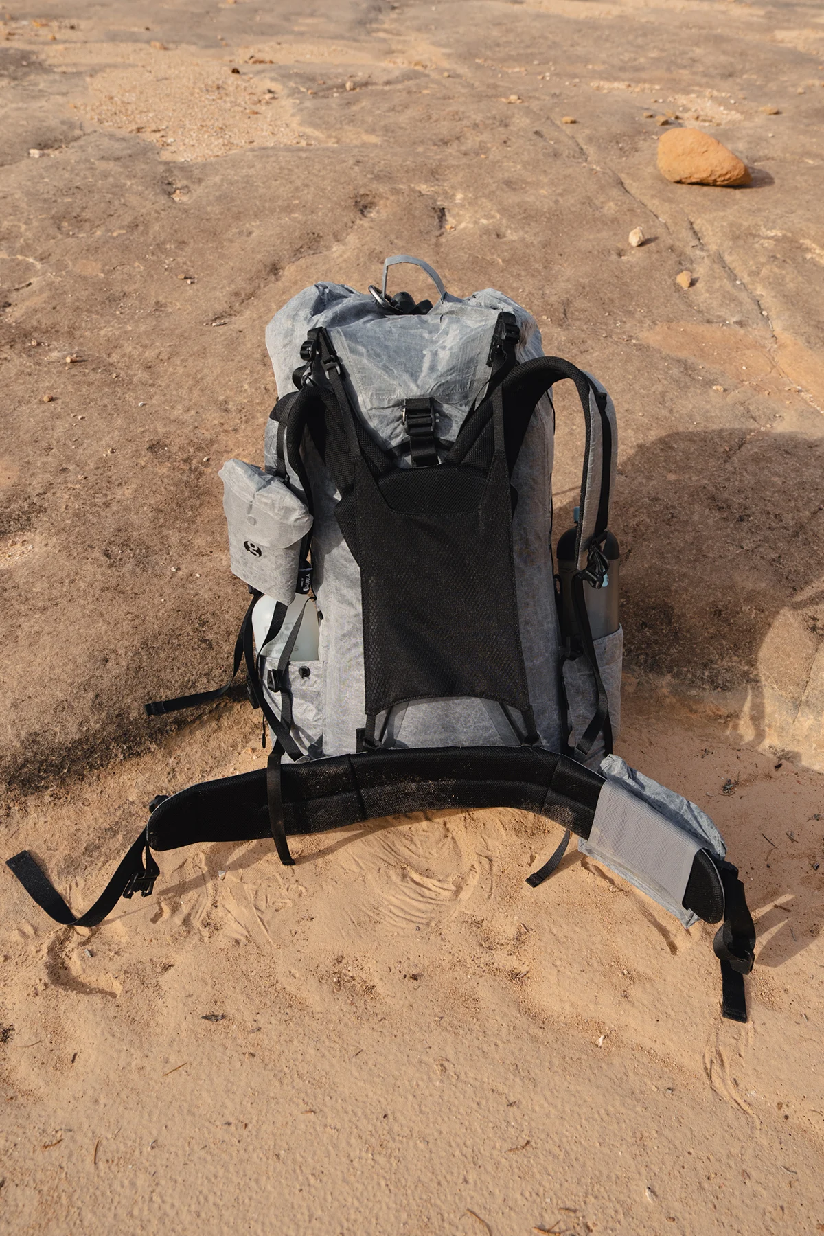 Vertical shot of the Gossamer Gear Mirage 40 showing fit and suspension on a hiker.