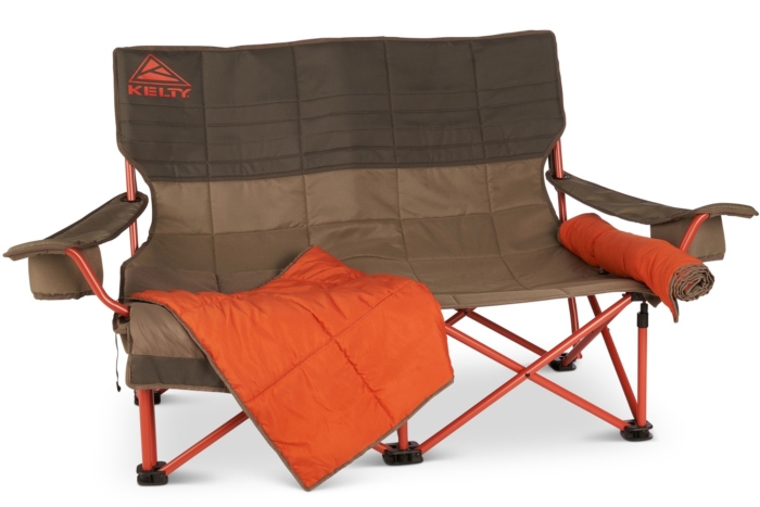 A Kelty Low Loveseat Nest double camping chair at a campsite.