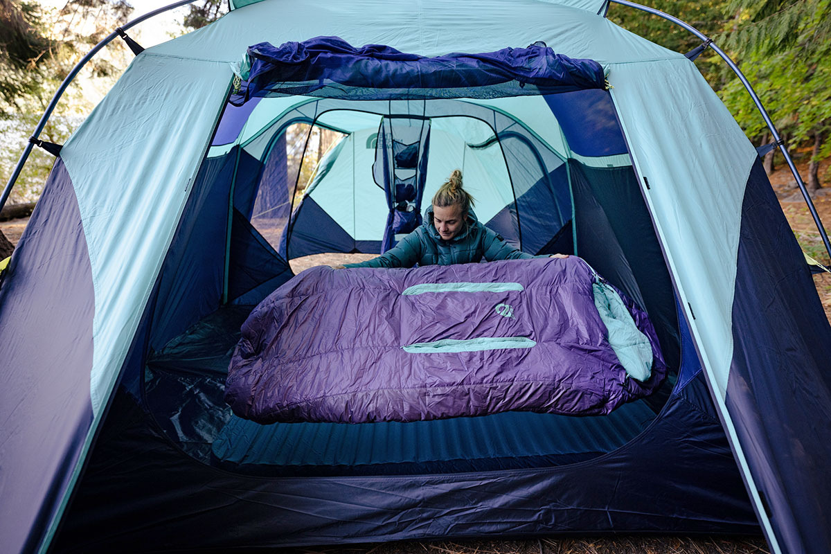 A Nemo Forte sleeping bag laid out inside a tent showing its wider elbow and knee area.