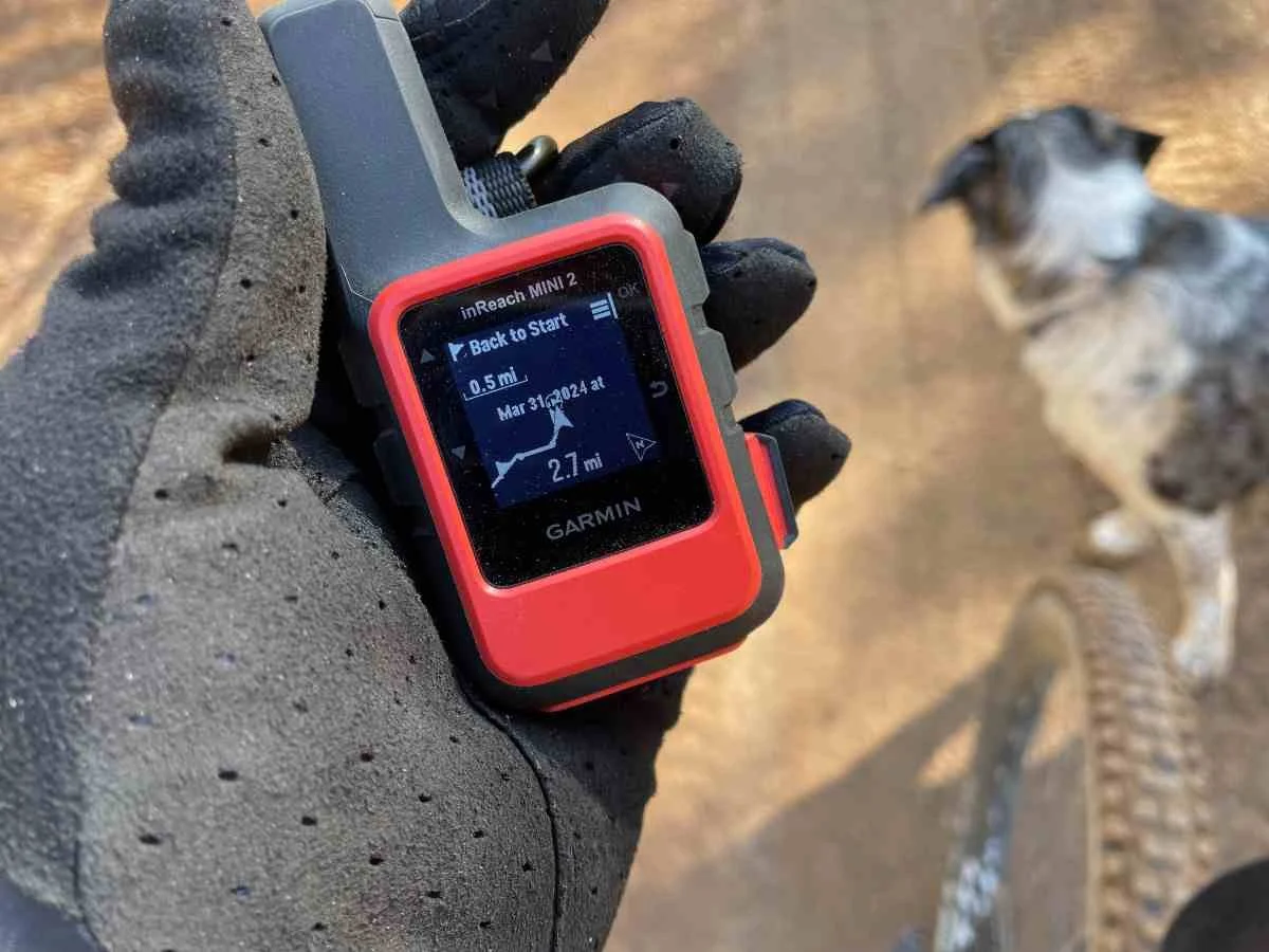 Close-up of the Garmin inReach Mini 2 screen showing TracBack breadcrumb navigation.
