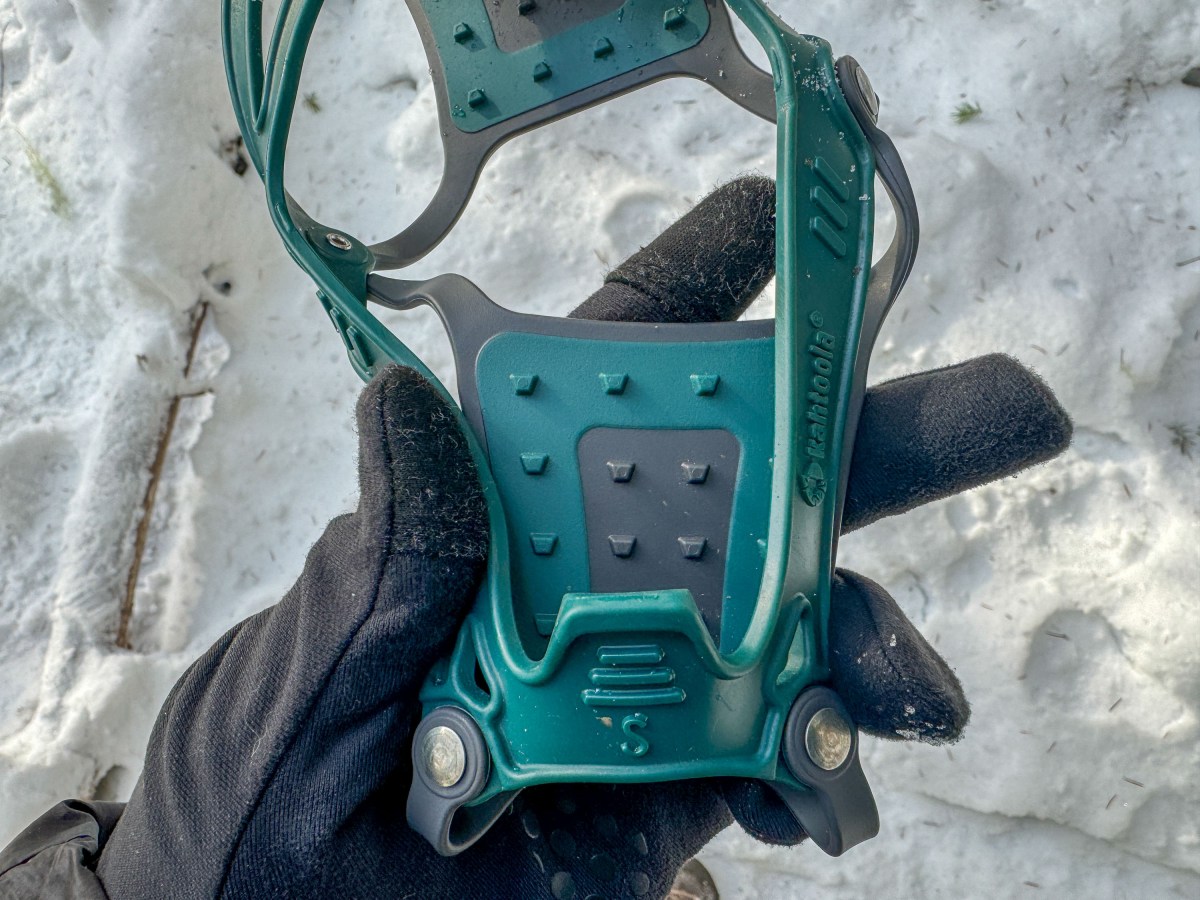 Tungsten carbide studs on a low-profile traction device designed for running shoes.