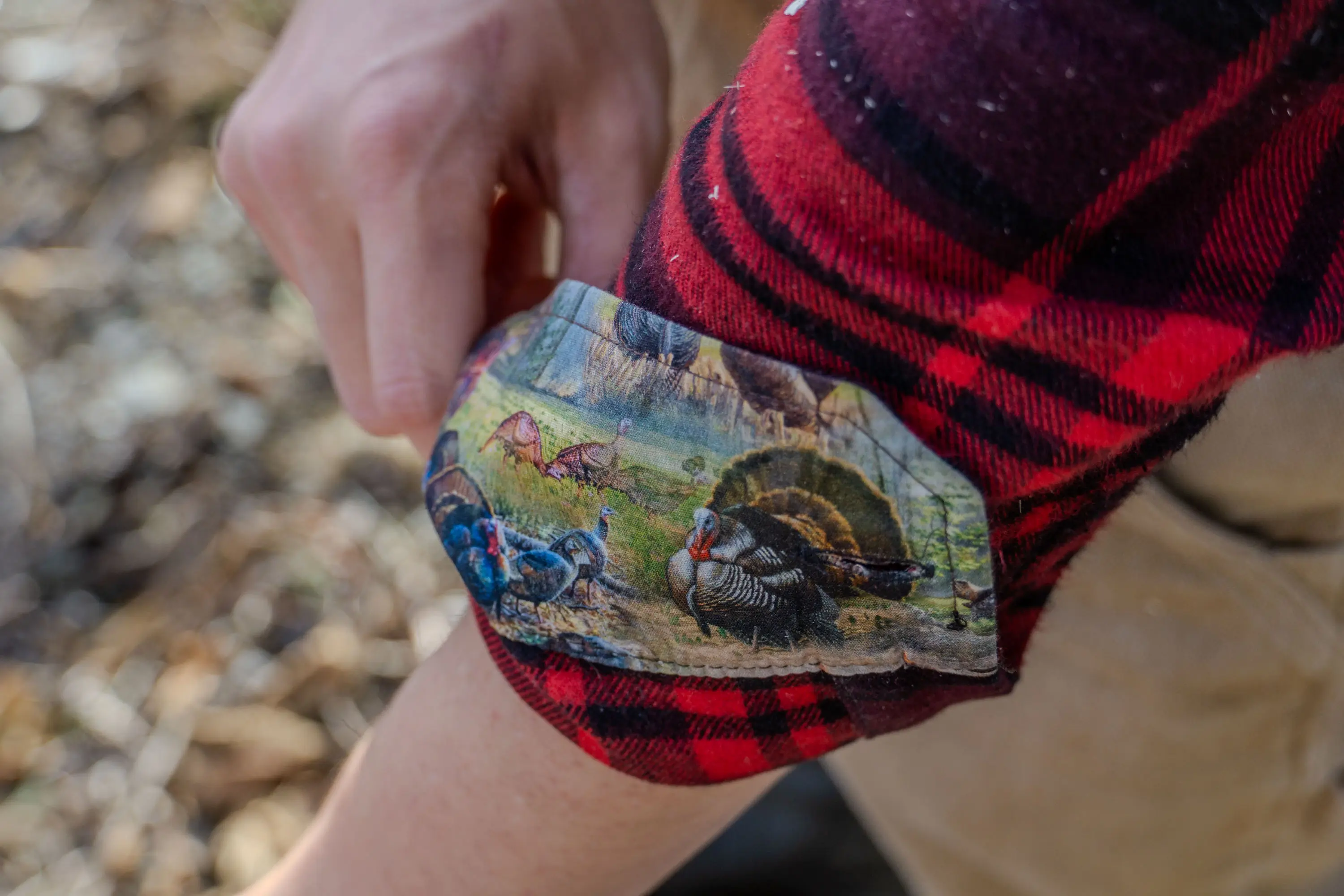 Detailed view of a premium flannel shirt cuff featuring nylon backing and unique interior prints.