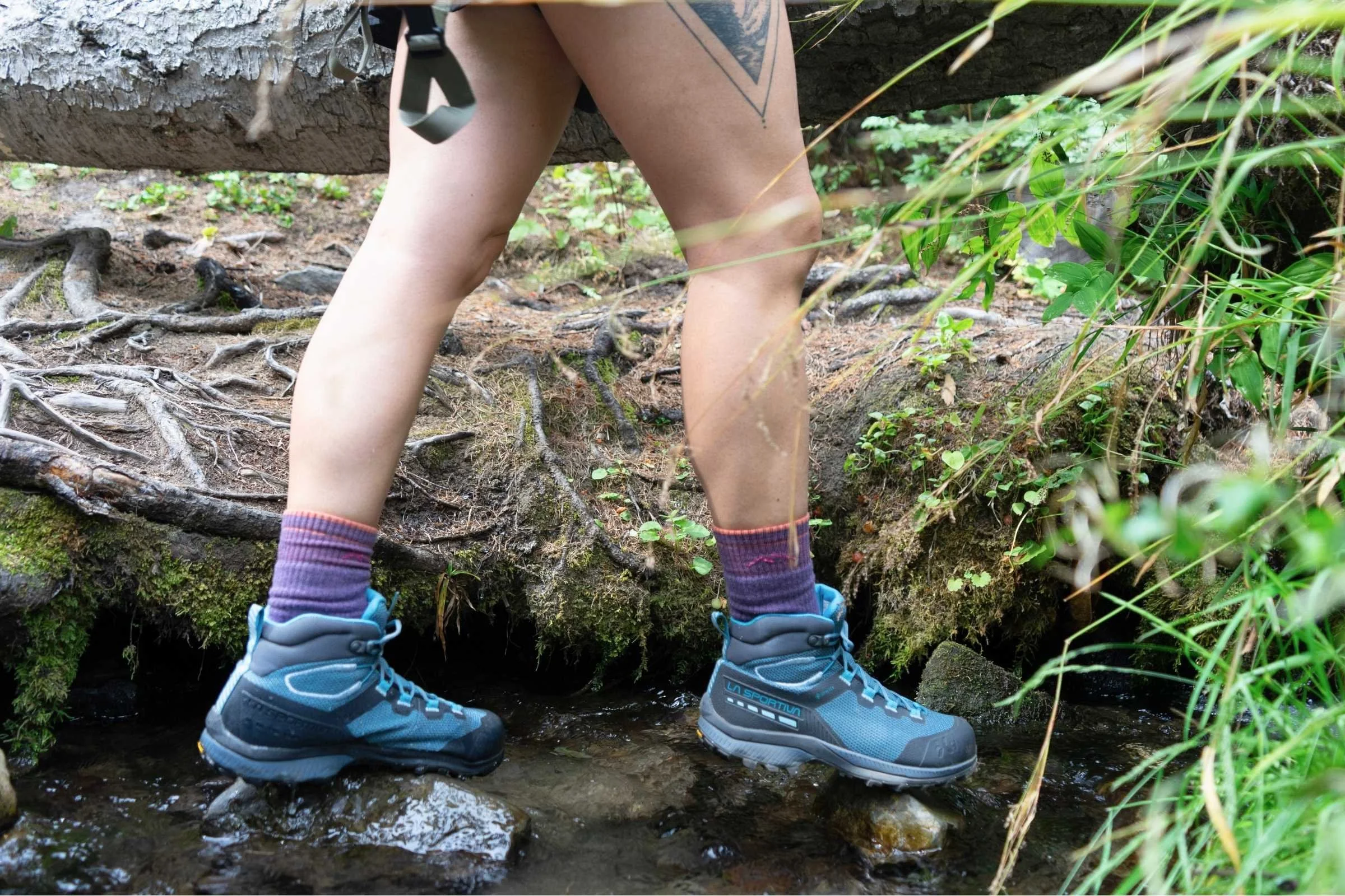 La Sportiva TX Hike boots being submerged in a shallow mountain stream.