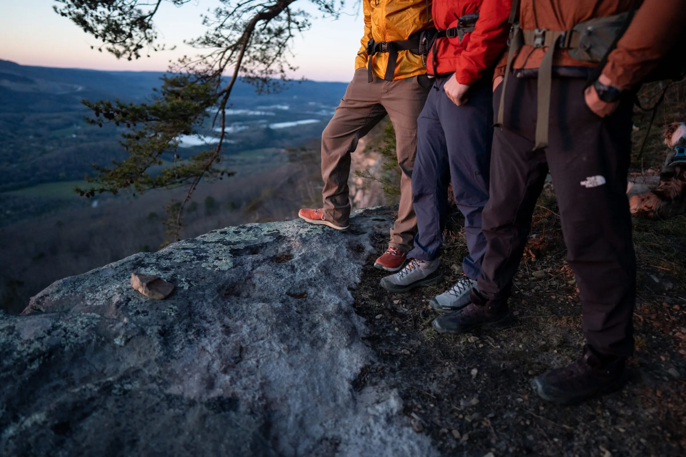 A side-by-side comparison of three different hiking boot midsoles showing varying thicknesses.