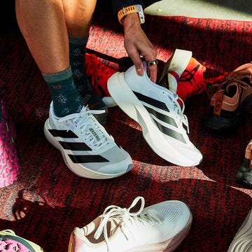 A collection of performance running shoes next to cushioned recovery footwear.