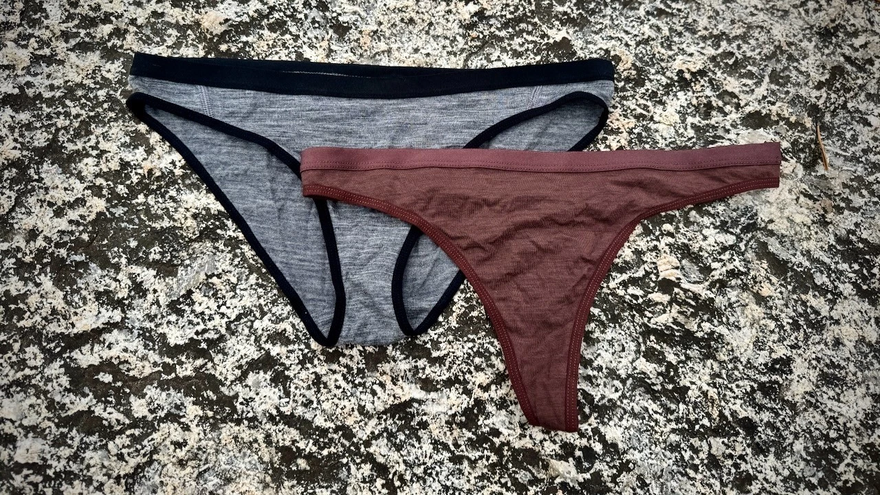 A close-up of a Merino wool Icebreaker Siren underwear held in hand.