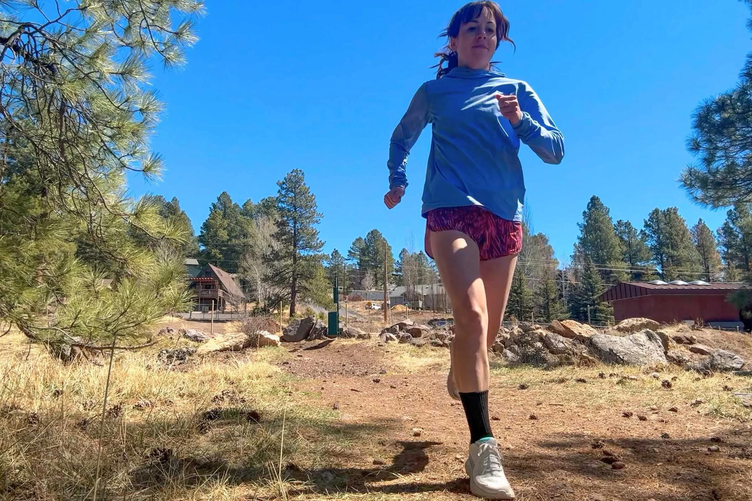 The Hoka Clifton 10 being worn in a casual, everyday setting outdoors.