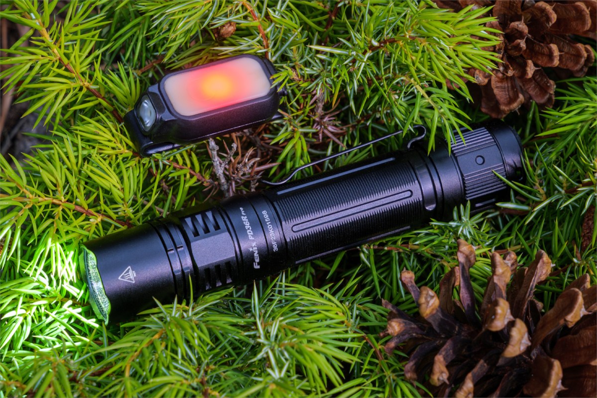 Fenix PD36R PRO flashlight and battery in its retail gift packaging.