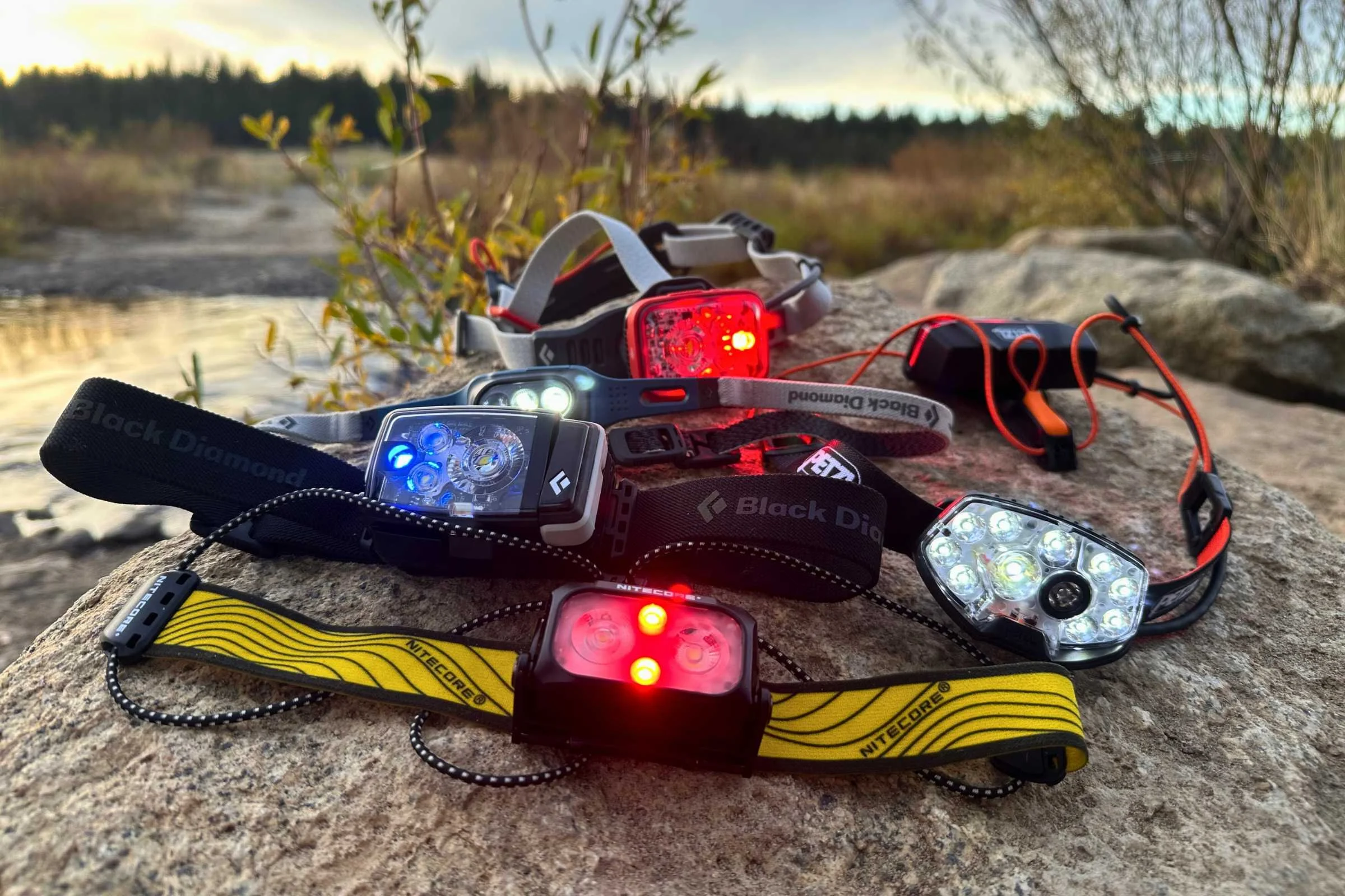A collection of five high-performance running headlamps grouped together for comparison.