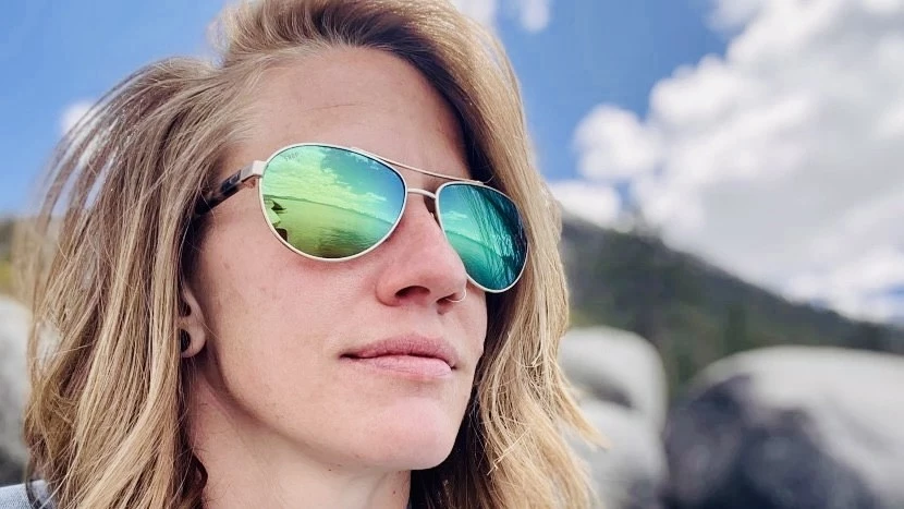 A woman wearing Costa del Mar Fernandina sunglasses.