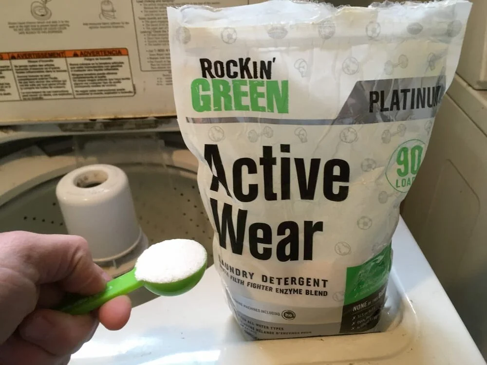 Rockin' Green Active Wear detergent bag next to training gear.