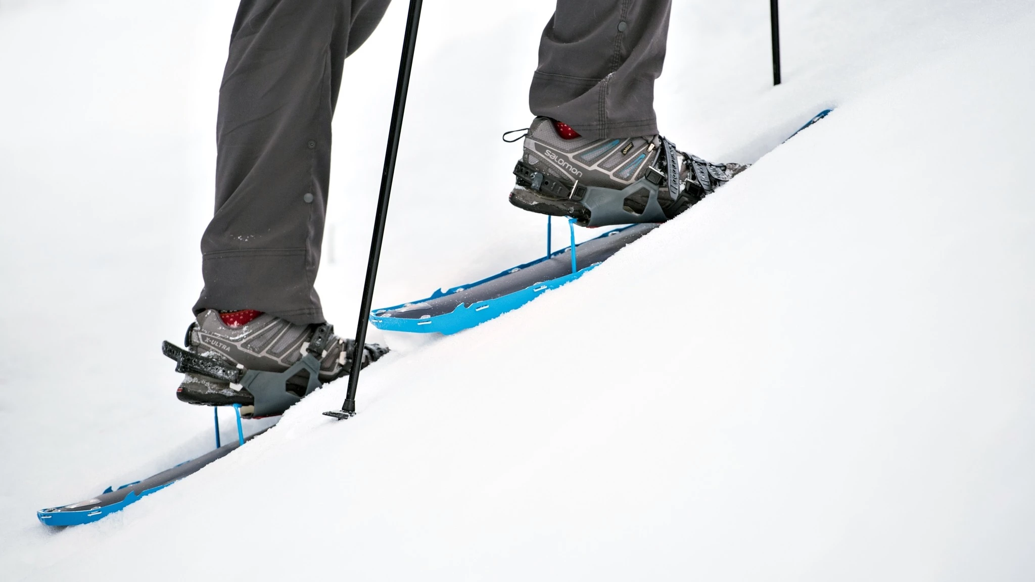Close-up of a snowshoe with the heel lift or 'televator' engaged.