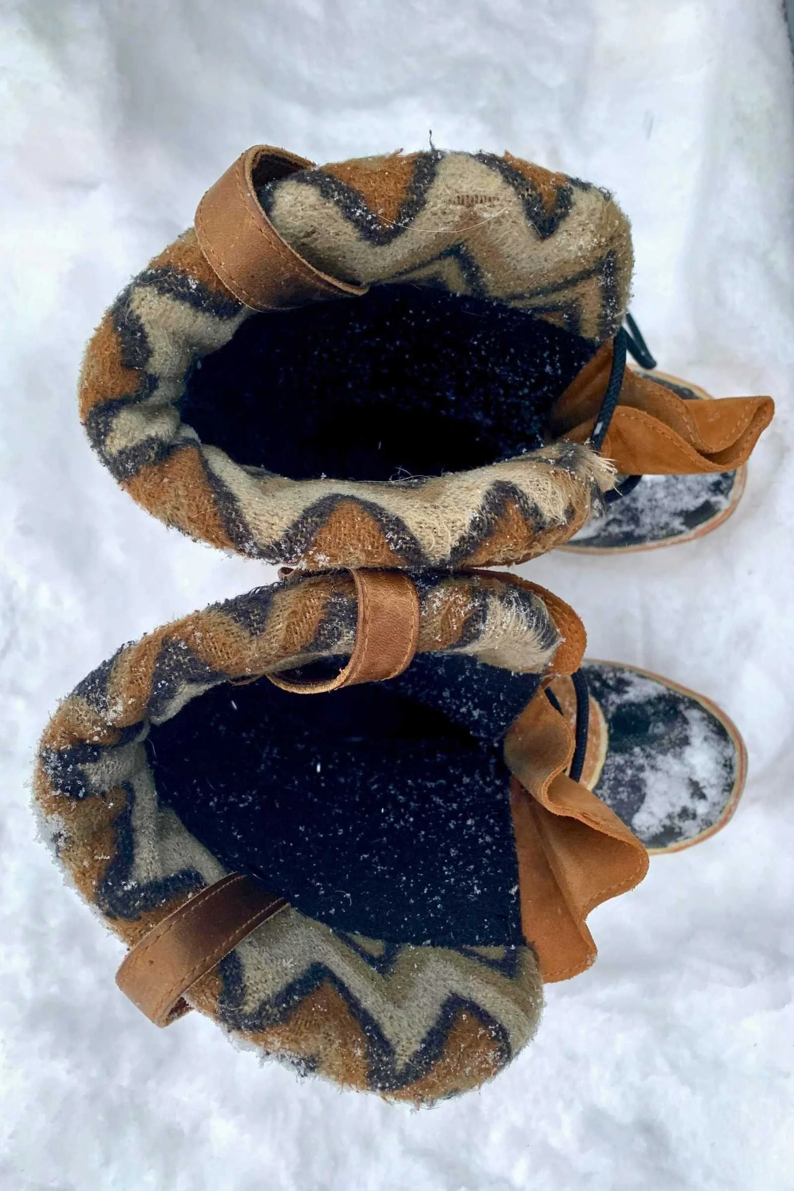 Extreme close-up of the plush shearling lining inside a high-quality Sorel winter boot.