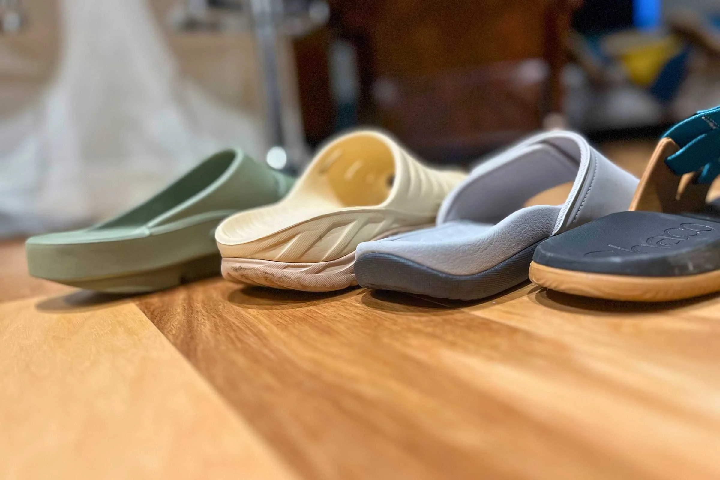 Close-up of the interior footbeds of various recovery shoes to show different arch heights and contours.
