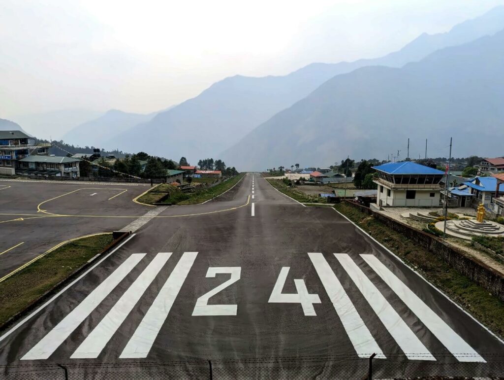 The short mountain runway and surrounding buildings of Tenzing-Hillary Airport in Lukla.