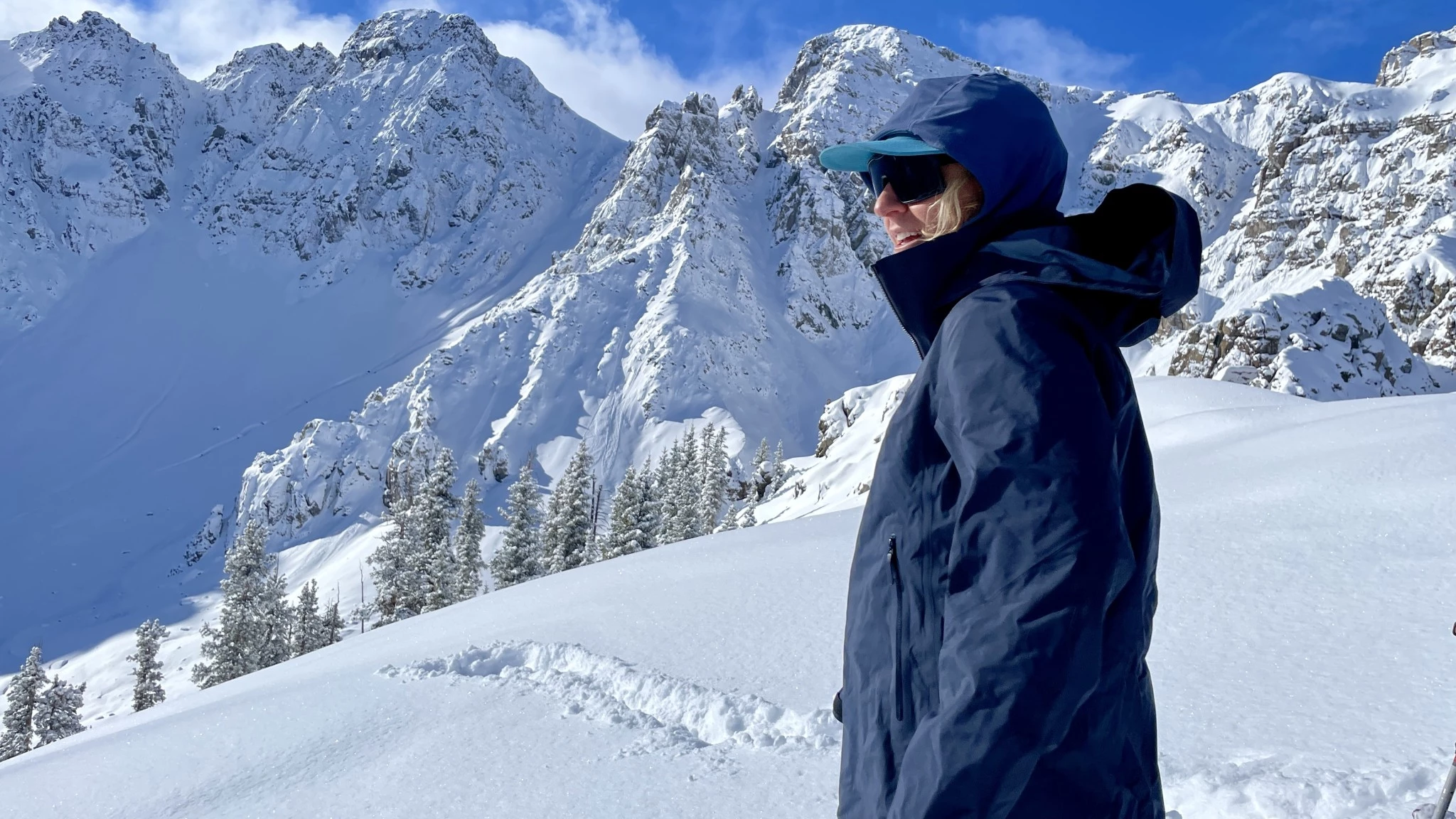 Tester wearing an Arc'teryx Beta AR hardshell jacket demonstrating ease of movement during an alpine approach.