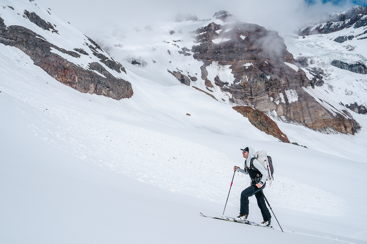 A man ski touring up a glacier, highlighting the need for mobility.