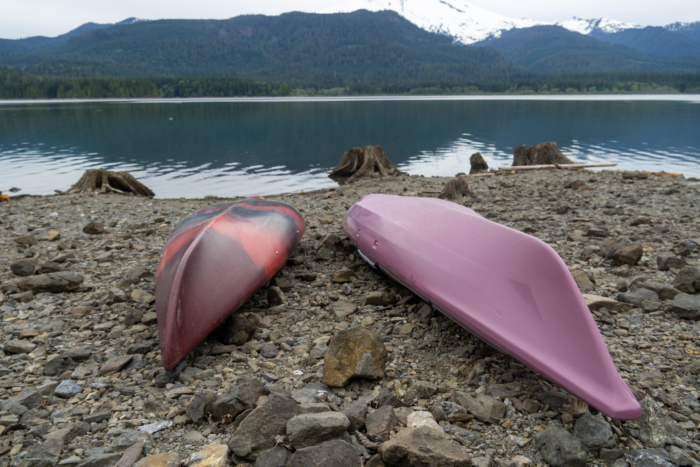 Comparison of two kayak hulls showing V-shape and rounded designs.