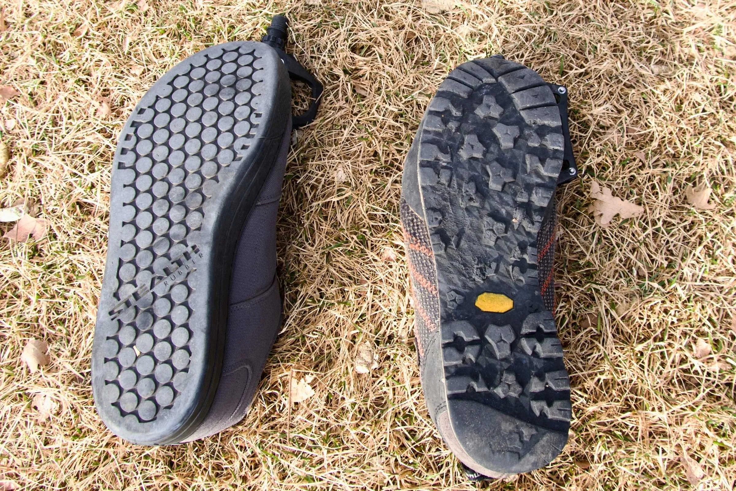 Comparison of a mountain bike shoe sole with no damage versus a hiking shoe sole torn by pedal pins.
