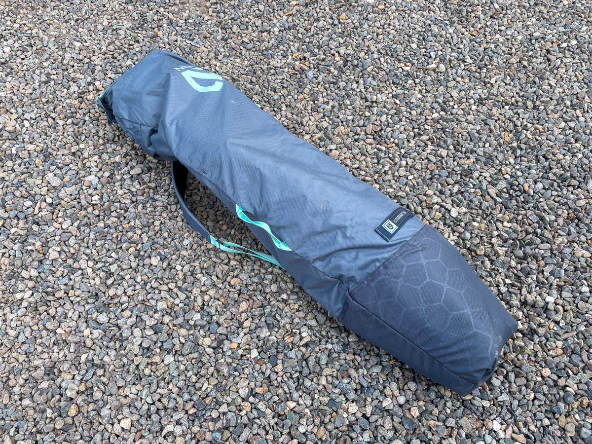 The NEMO Stargaze EVO-X folded into its dark grey rectangular padded carrying case.