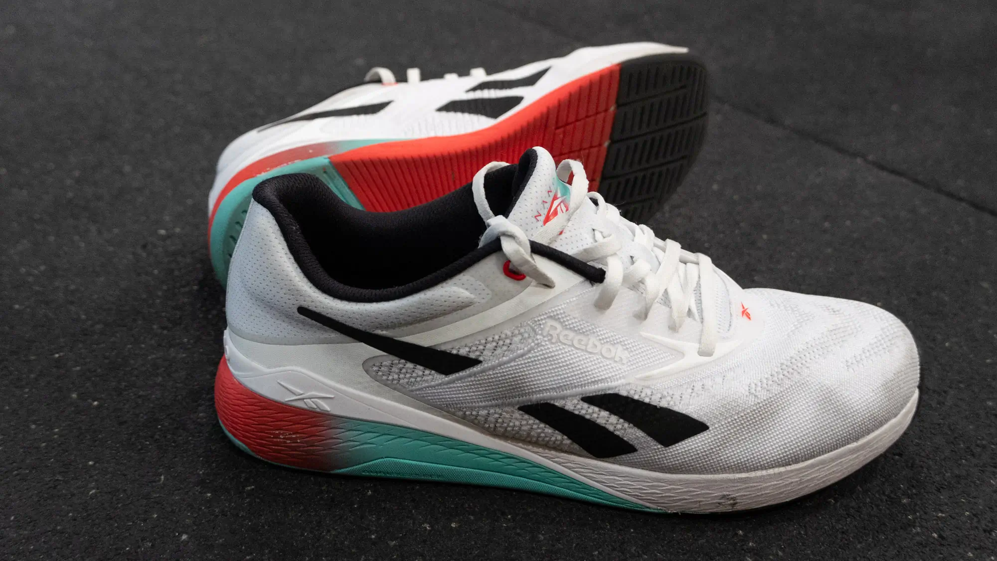A profile shot of the Reebok Nano X5 shoe emphasizing its versatile outsole and midsole design.