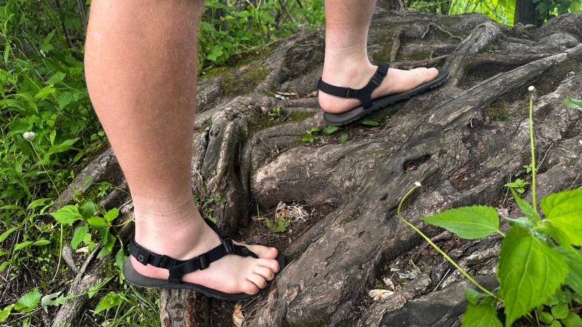 Side view of the Xero H-Trail minimalist sandal showing its thin, flexible sole.