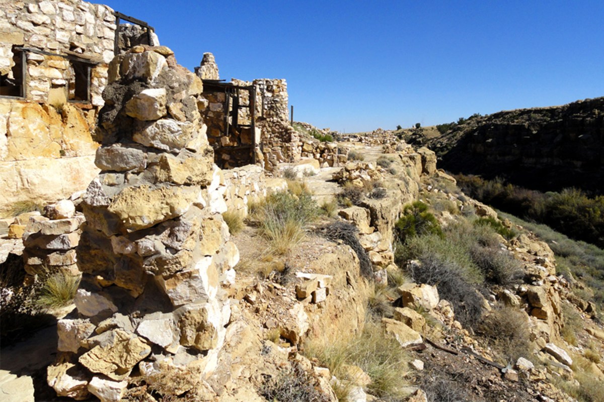Dilapidated structures and stone ruins of the Two Guns ghost town in Arizona.
