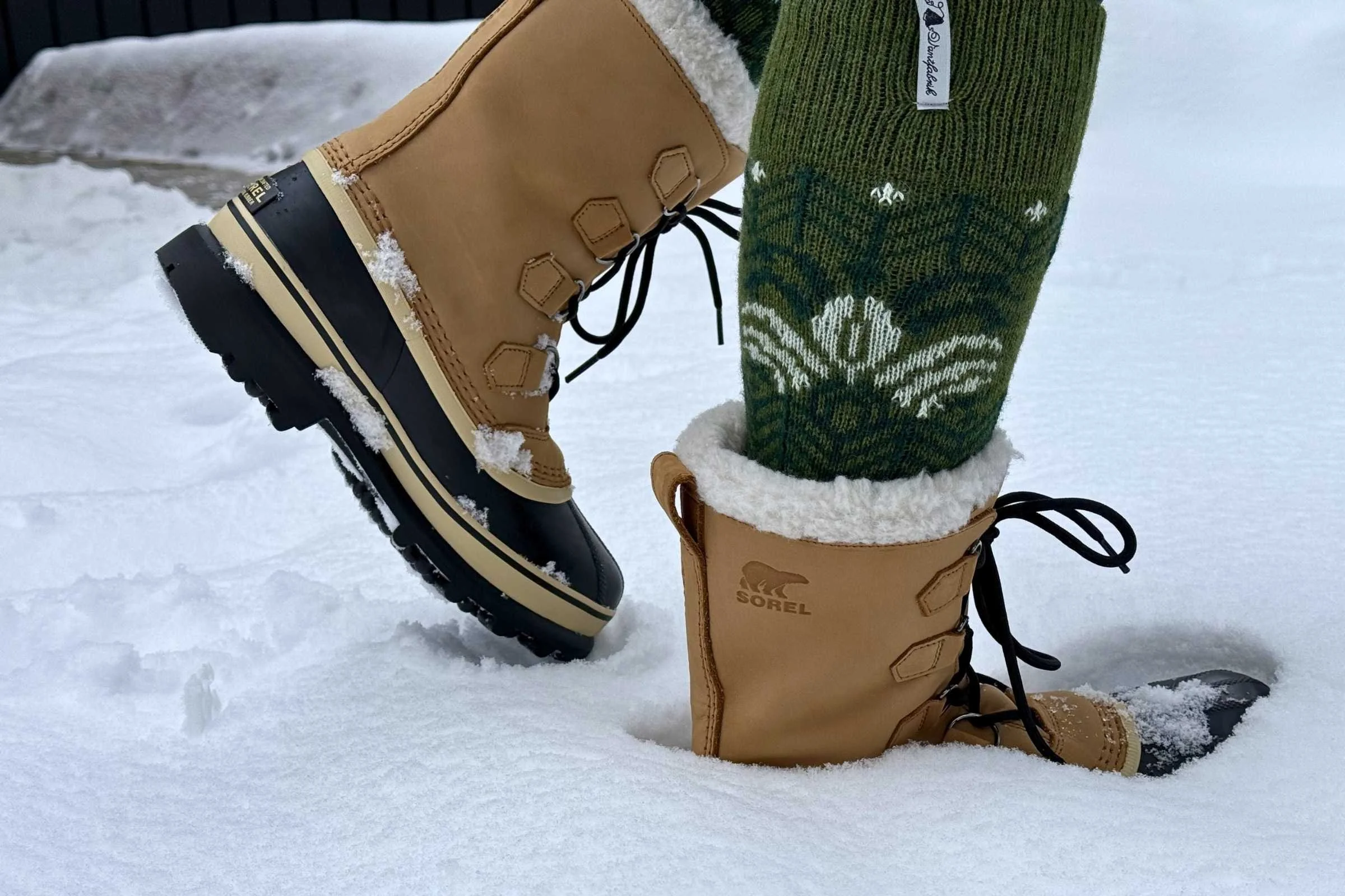Sorel Caribou pac boots standing in deep, fresh snow.