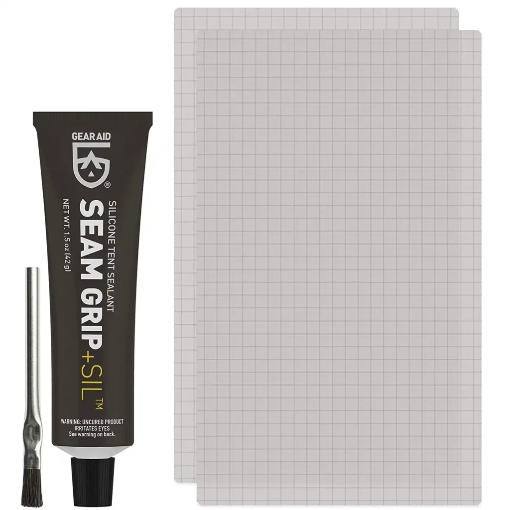 Gear Aid Seam Grip SIL silicone repair adhesive tube being held beside a silicone-treated tent.