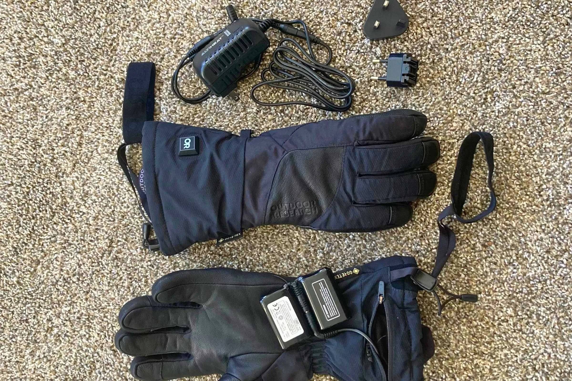 Outdoor Research Prevail Heated Glove kit including batteries and wall charger.