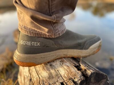 SITKA Rover GTX boots being worn in tall grass during a field performance test.