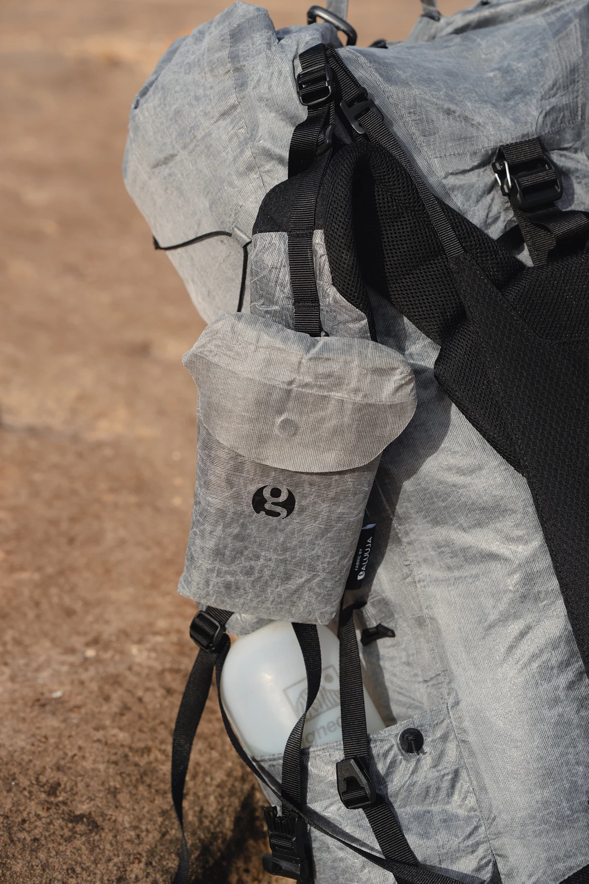 Side profile view of the Gossamer Gear Mirage 40 showing the roll-top and fabric texture.
