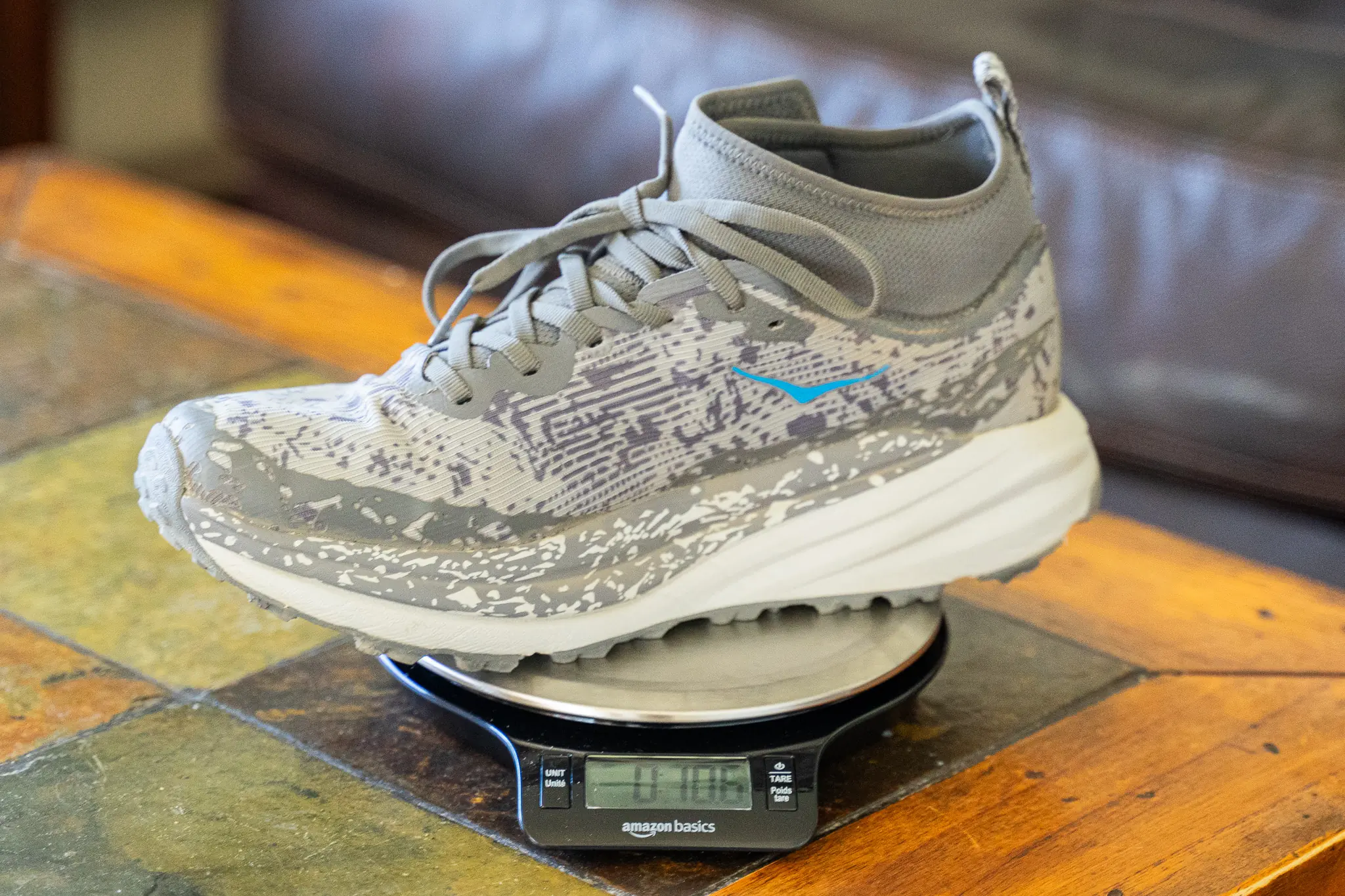 Close-up of the plush midsole and lugged outsole of a Hoka Speedgoat 6.