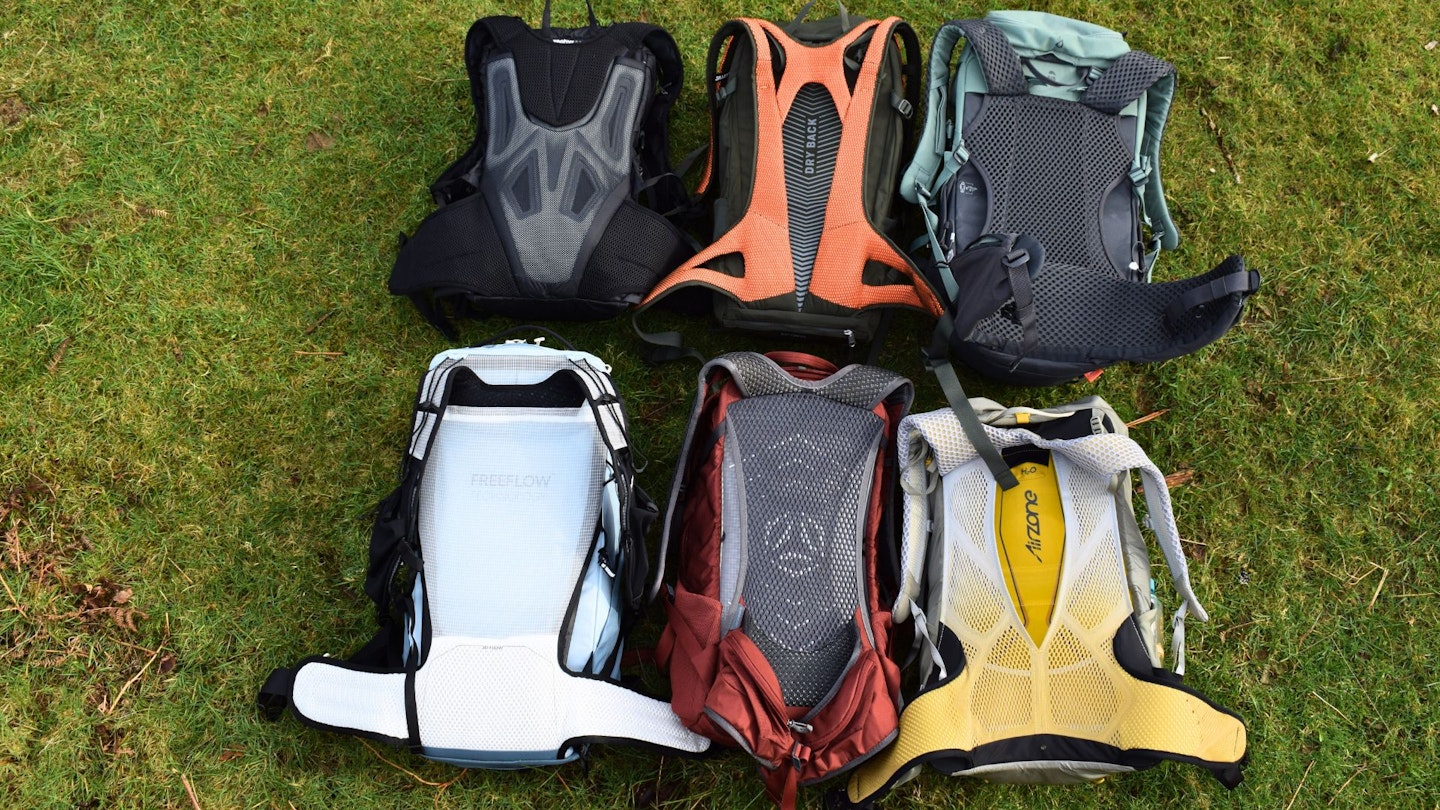 A comparison grid showing six different hiking daypack back panels with various mesh and foam configurations.