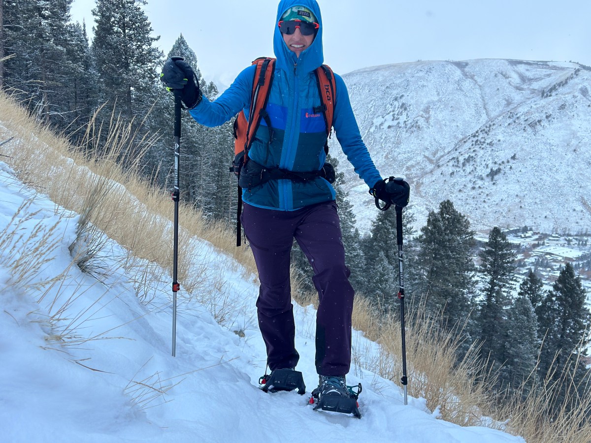 The KEEN Revel IV Mid Polar winter hiking boots resting in deep snow.