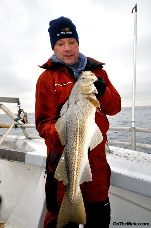 A chrome diamond jig lure with a single hook, commonly used for vertical jigging in winter saltwater conditions.