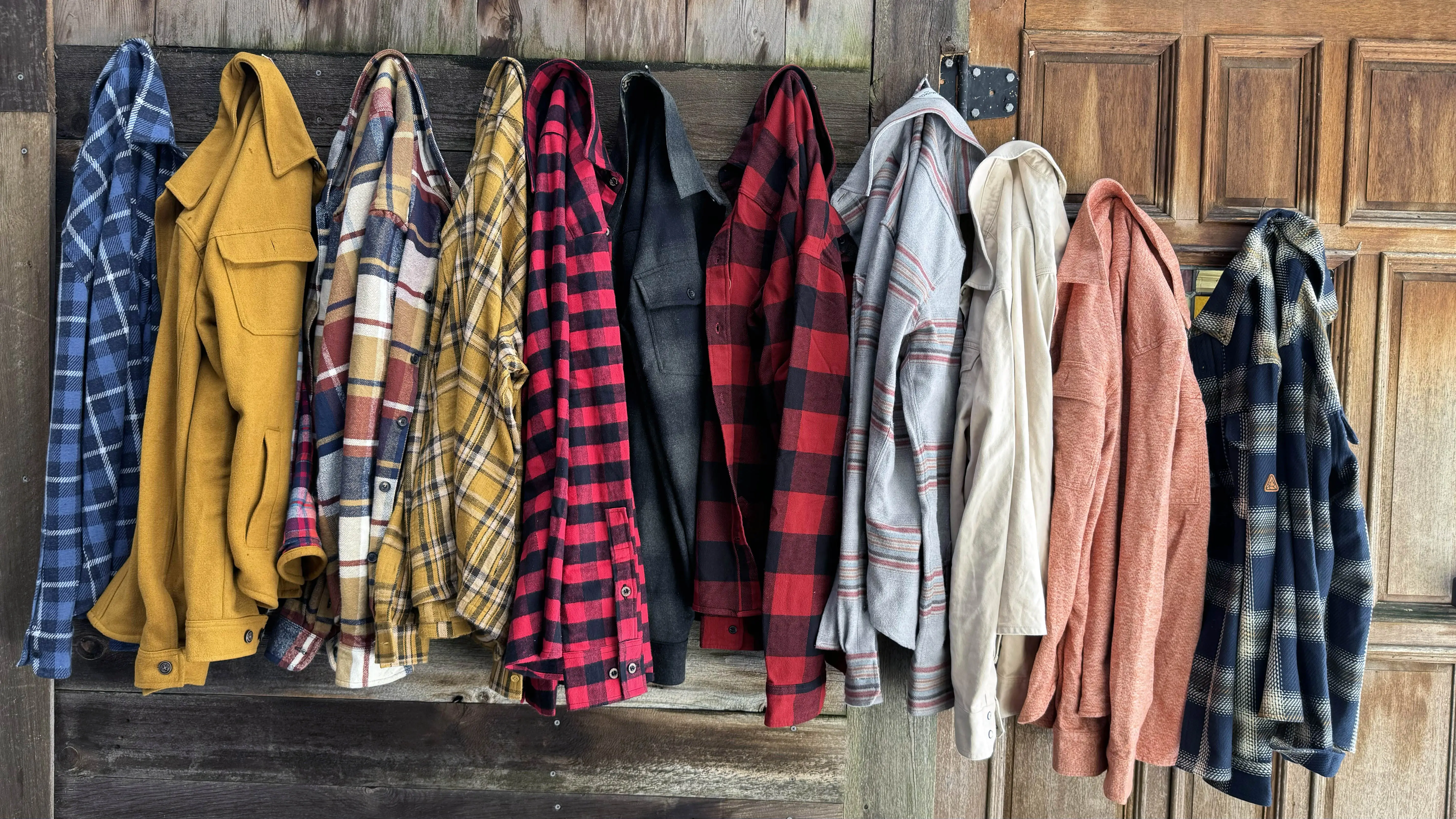 A diverse array of flannel shirts showcasing various plaid patterns and designs.