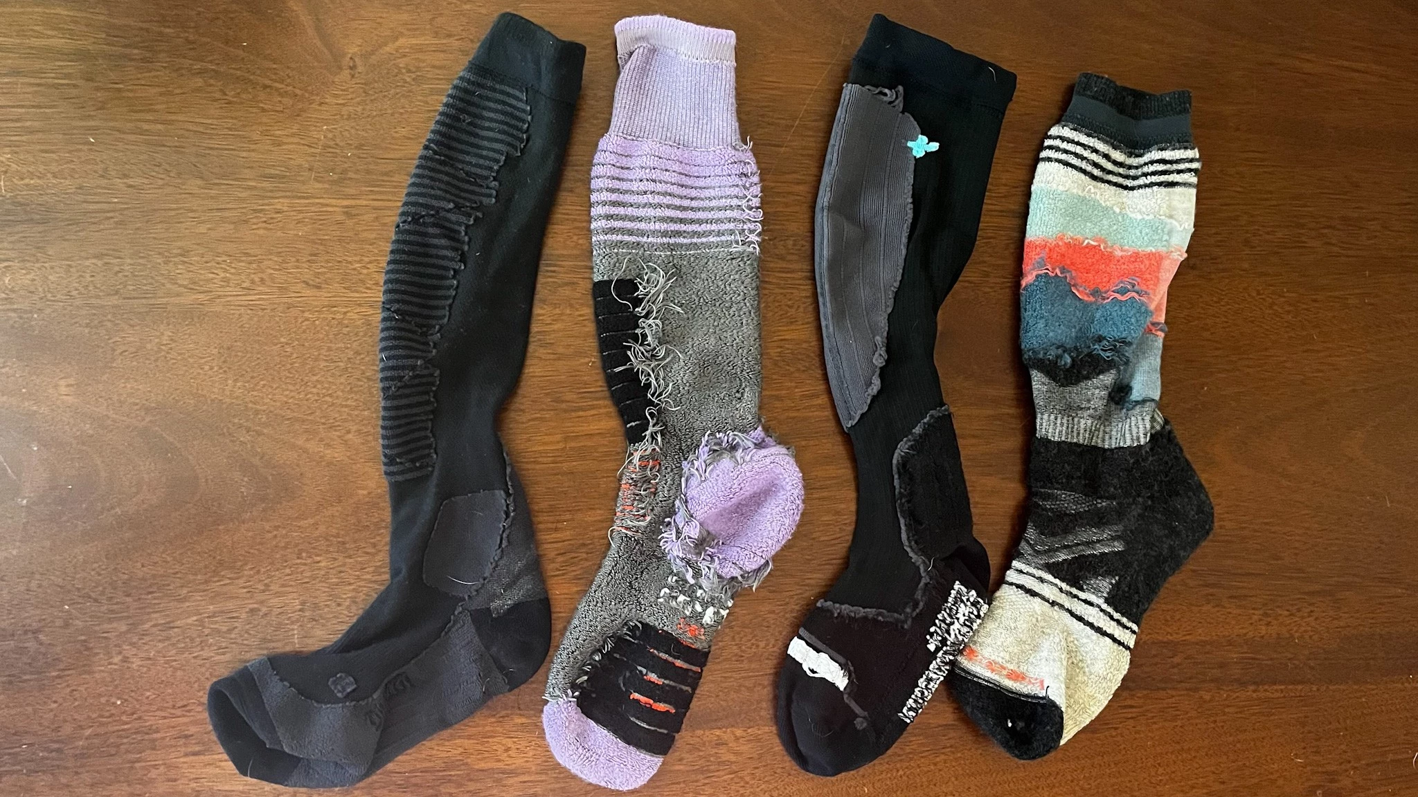 Various ski socks turned inside out to show different shin padding configurations.