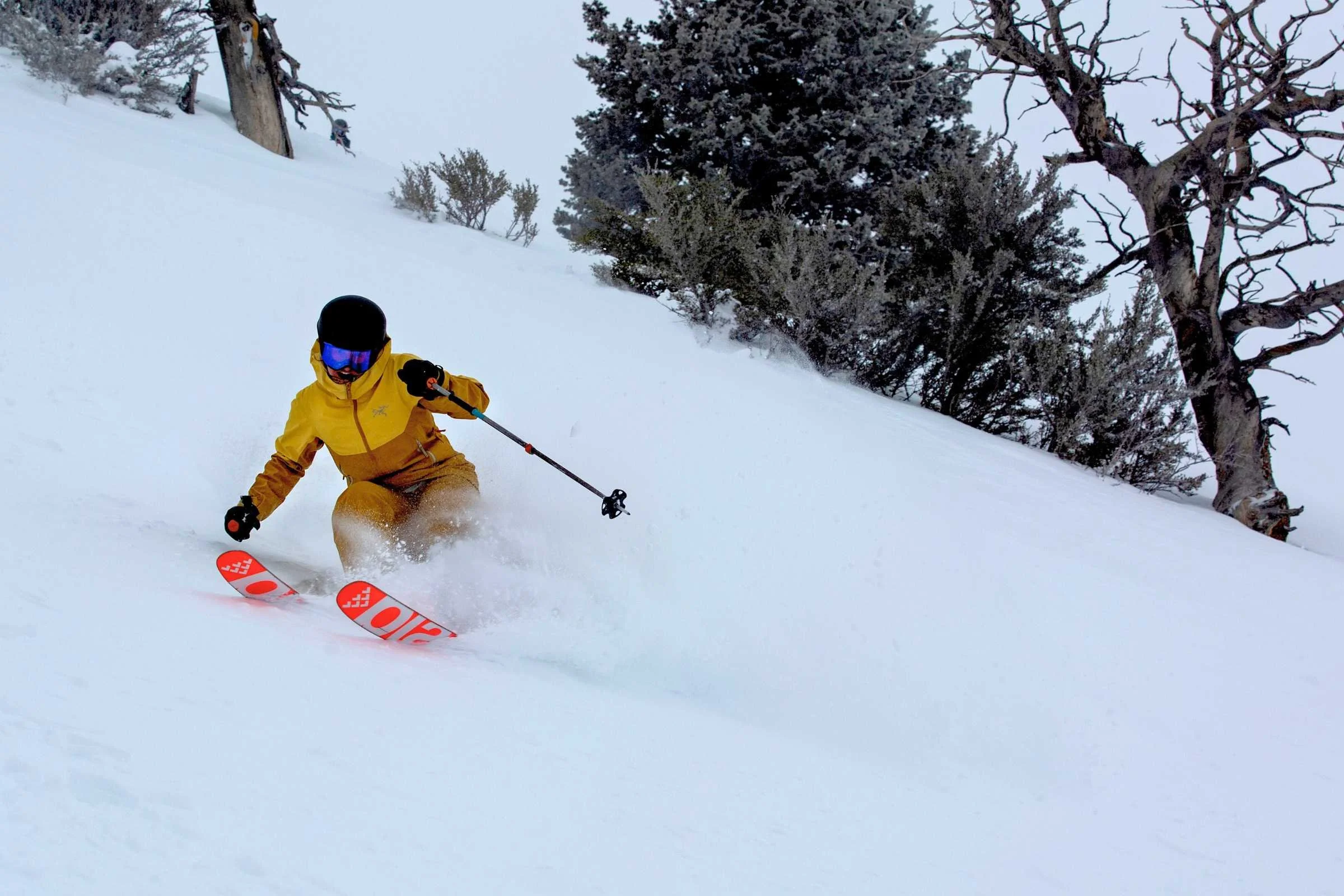 A woman modeling the Arc'teryx Sentinel jacket to show its freeride fit and style.