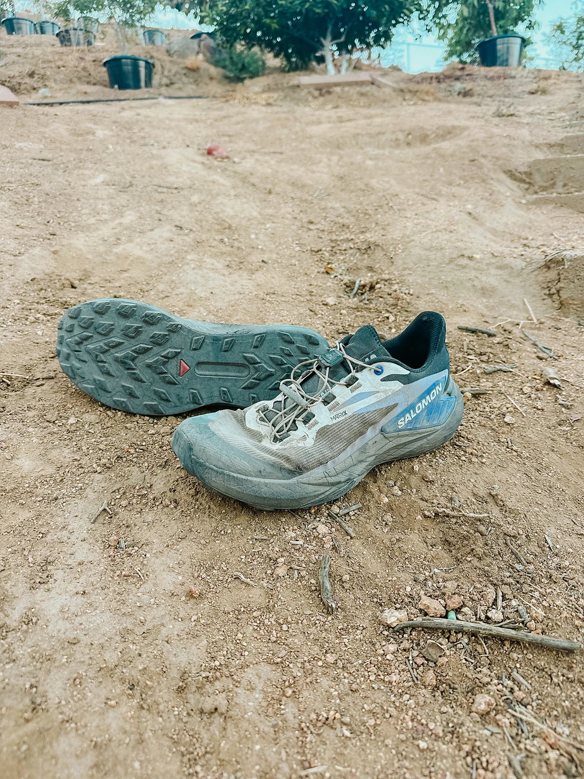 The worn outsole of a Salomon Genesis shoe after significant trail mileage