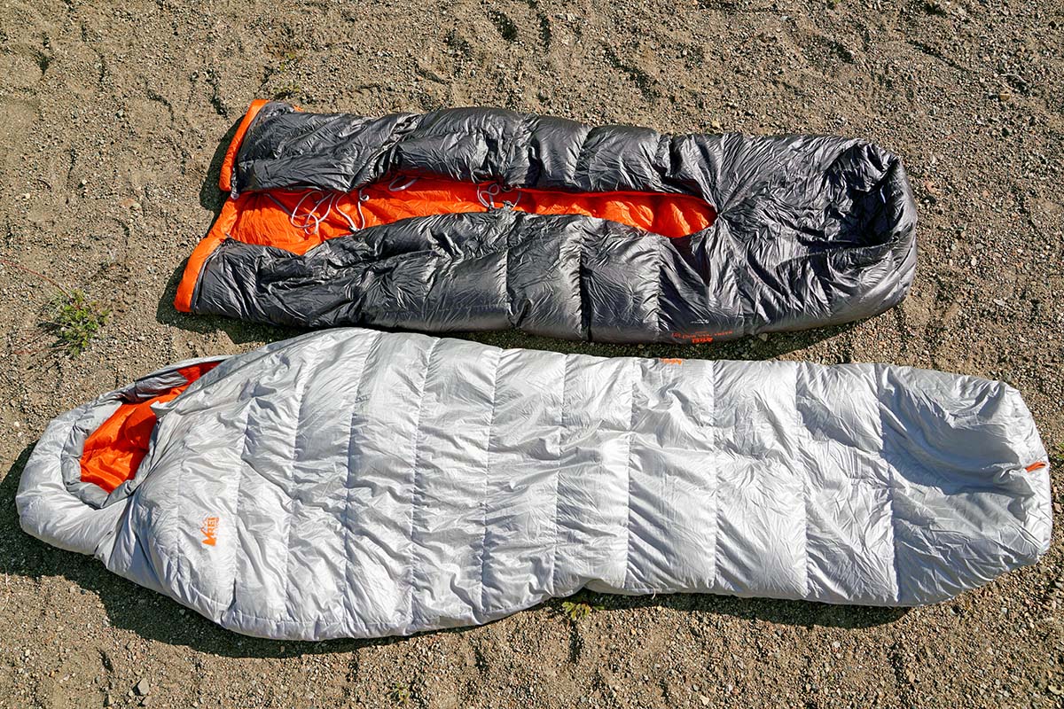 An REI Co-op Magma sleeping bag and an REI Magma Trail quilt placed side by side for comparison.